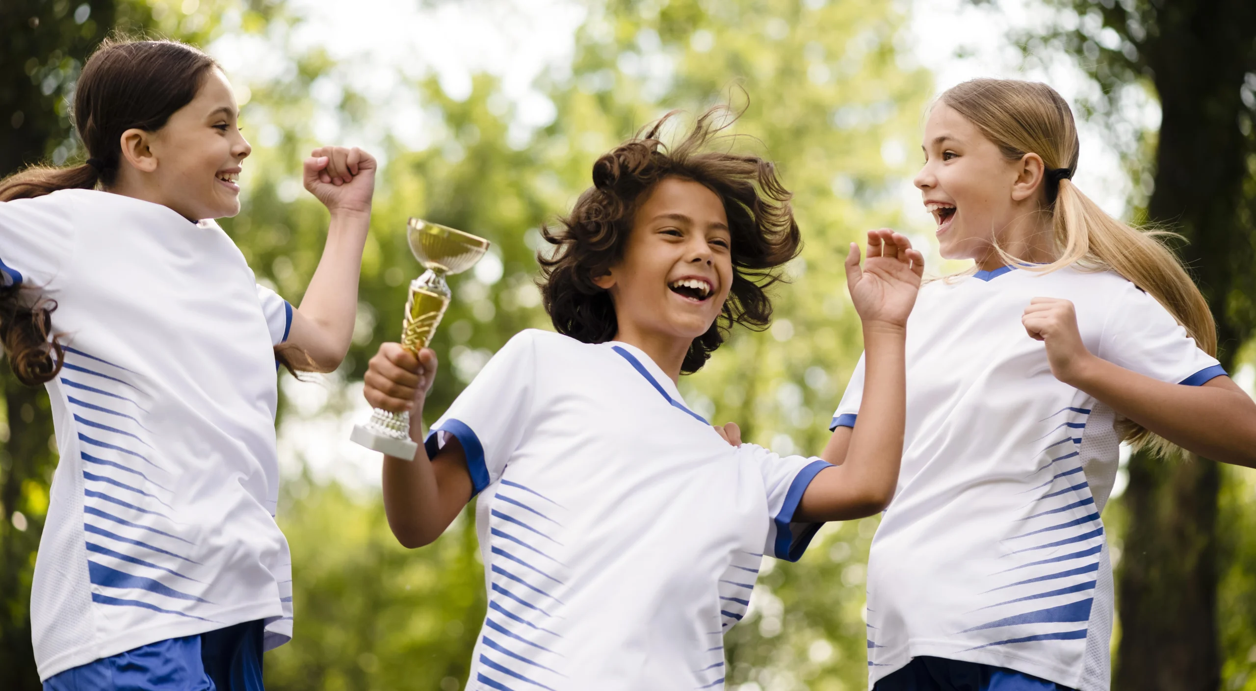 Kids being happy after winning football match 690e0b3cce902