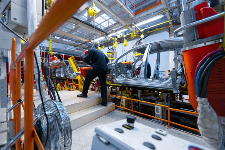 Workers assemble car modern automated assembly line cars latest technological neutral technologies production cars plant assembly cars conveyor 6a0331a19baea